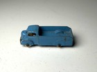 Blue vintage Tootsietoy #234 box truck with worn paint, silver wheels, and “Made in U.S.A.” text on top.