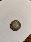 1883 Seated Liberty Dime In VG To XF Condition.