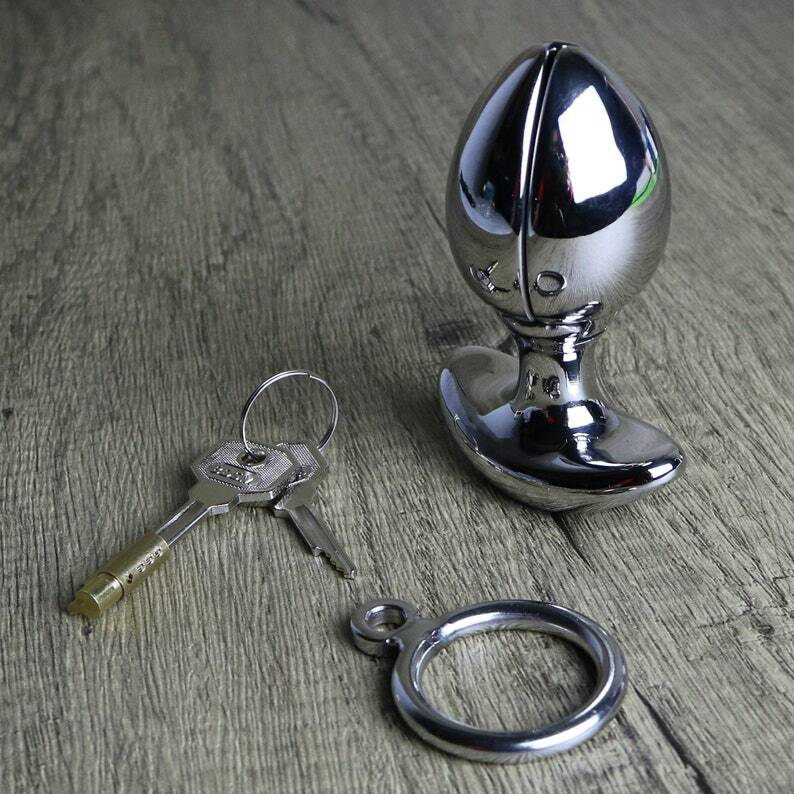 locking anal plug porn Locking butt plug onto chastity slave