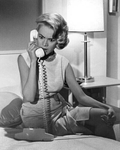 Sandra Dee sitting on bed holding telephone A Summer Place 24x36 inch poster - Picture 1 of 1