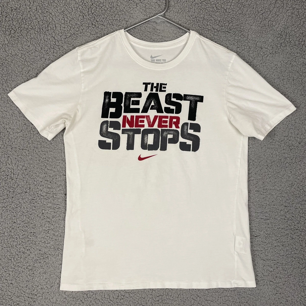 The beast never clearance stops nike shirt