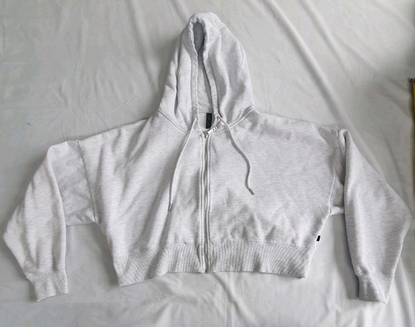 BODY marle zip-up cropped hoodie featuring a drawstring hood and ribbed hem. 5XL