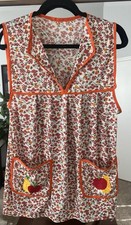 vintage-style floral cobbler apron, also known as a smock or coverall apron