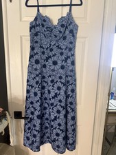 blue Sandro daisy guipure midi dress featuring a slim fit, twisted v-neckline.