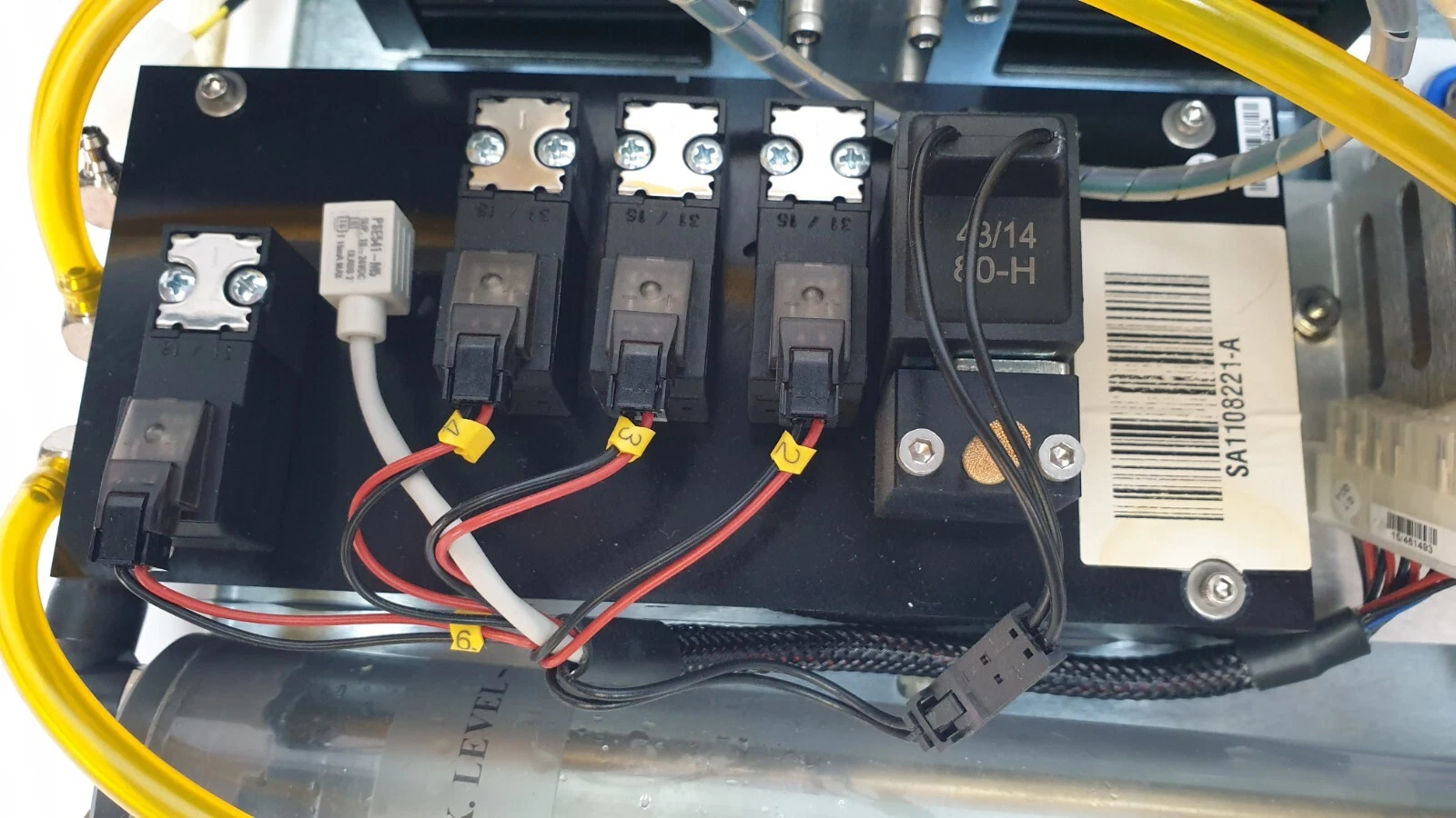 Valve block with numbered wire tags and barcode label SA1108221-A