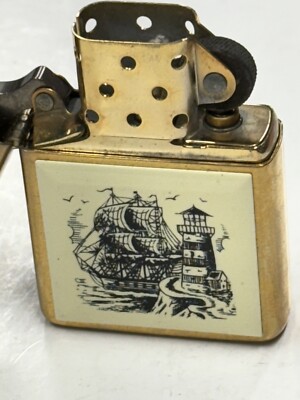 ZIPPO 1932 - 1991 SCRIMSHAW SHIP & LIGHTHOUSE BRASS LIGHTER