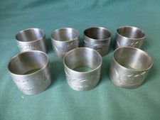 Seven Antique Silver Plated Napkin Rings with Engraved Decoration