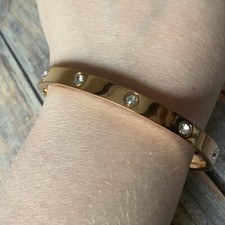 Rose gold colored Stainless steel rhinestone studded hinged bangle bracelet