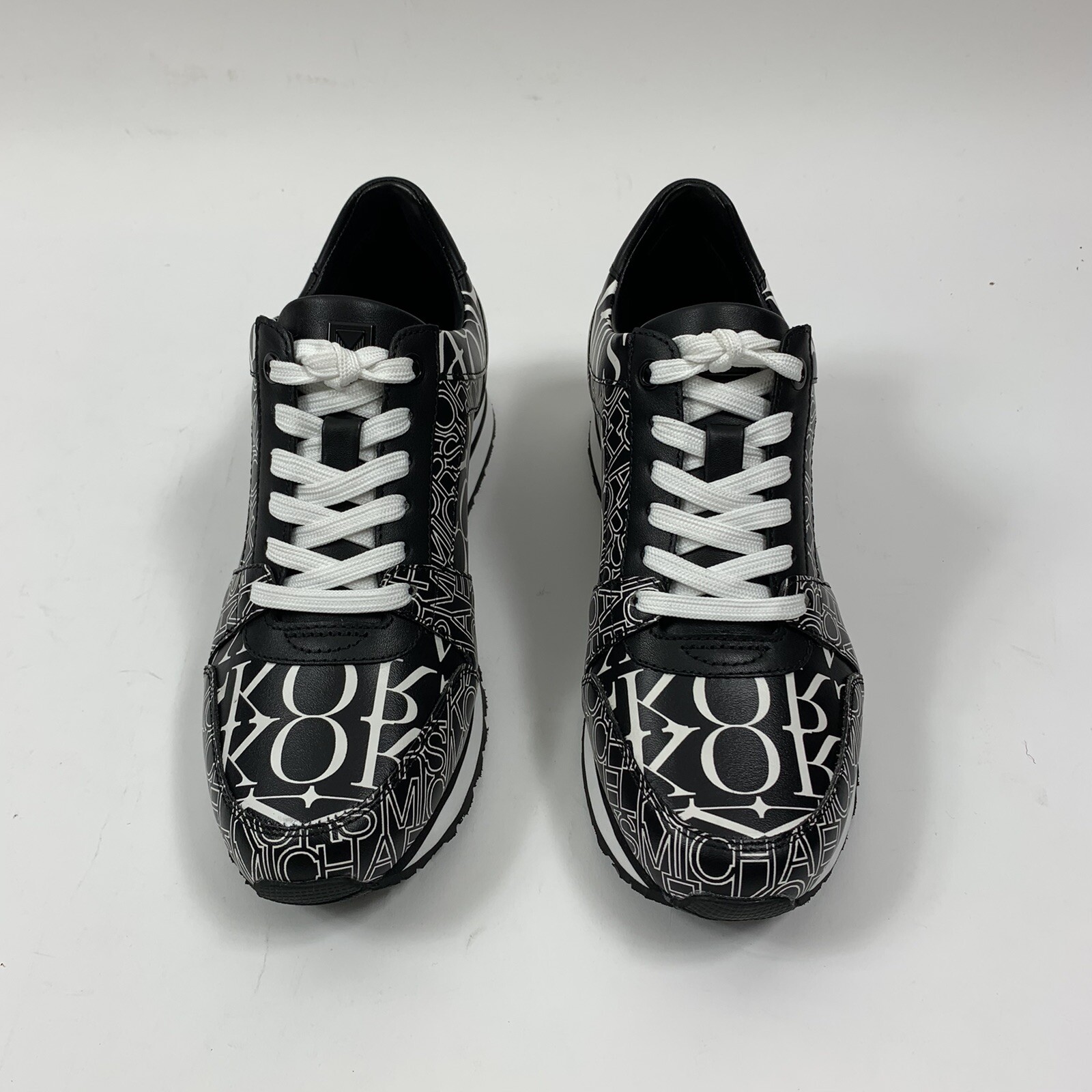 billie newsprint logo leather trainer