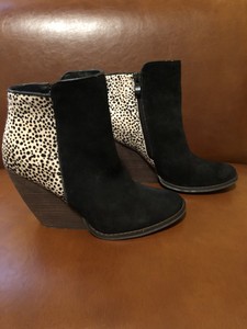 very volatile black booties