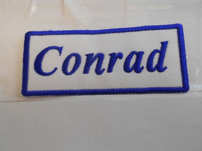 CONRAD  NEW EMBROIDERED  SEW / IRON ON NAME PATCH BLUE ON WHITE