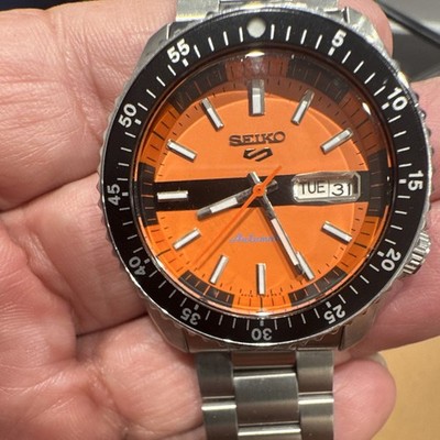 Seiko 5 Sports Automatic Day/Date Orange Dial 100m Black Bezel Bracelet