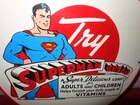 VINTAGE 1941 SUPERMAN BREAD 11 3/4" PORCELAIN METAL COMIC BOOK GASOLINE OIL SIGN