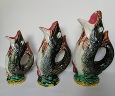 A Matching Set of Three 1890s George Jones Style Gurgling Fish Majolica Jugs