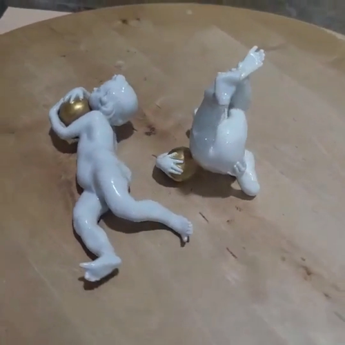 Vintage Porcelain Boy Playing Golden Ball Figurines Set of 2 Chipped Toes - Video 1 of 1