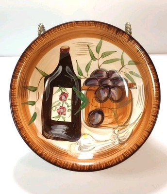 Muckleshoot Casino plate, wine bottle & grapes  Auburn, WA 1222o 8.5''D
