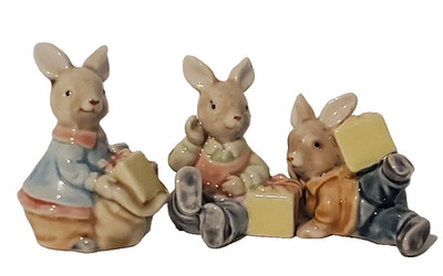 3 Easter Figurine Rabbit Magolica Ceramic holding gift boxes