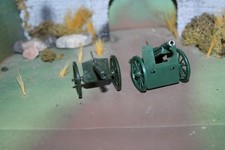 TWO TOY SOLDIER DIECAST FIELD CANNONS FIRING MECHANISMS, METAL SPOKE WHEELS