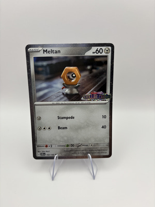 Meltan Cosmos Holo Stellar Crown Stamped Promo 102/142 NM Pokemon Card