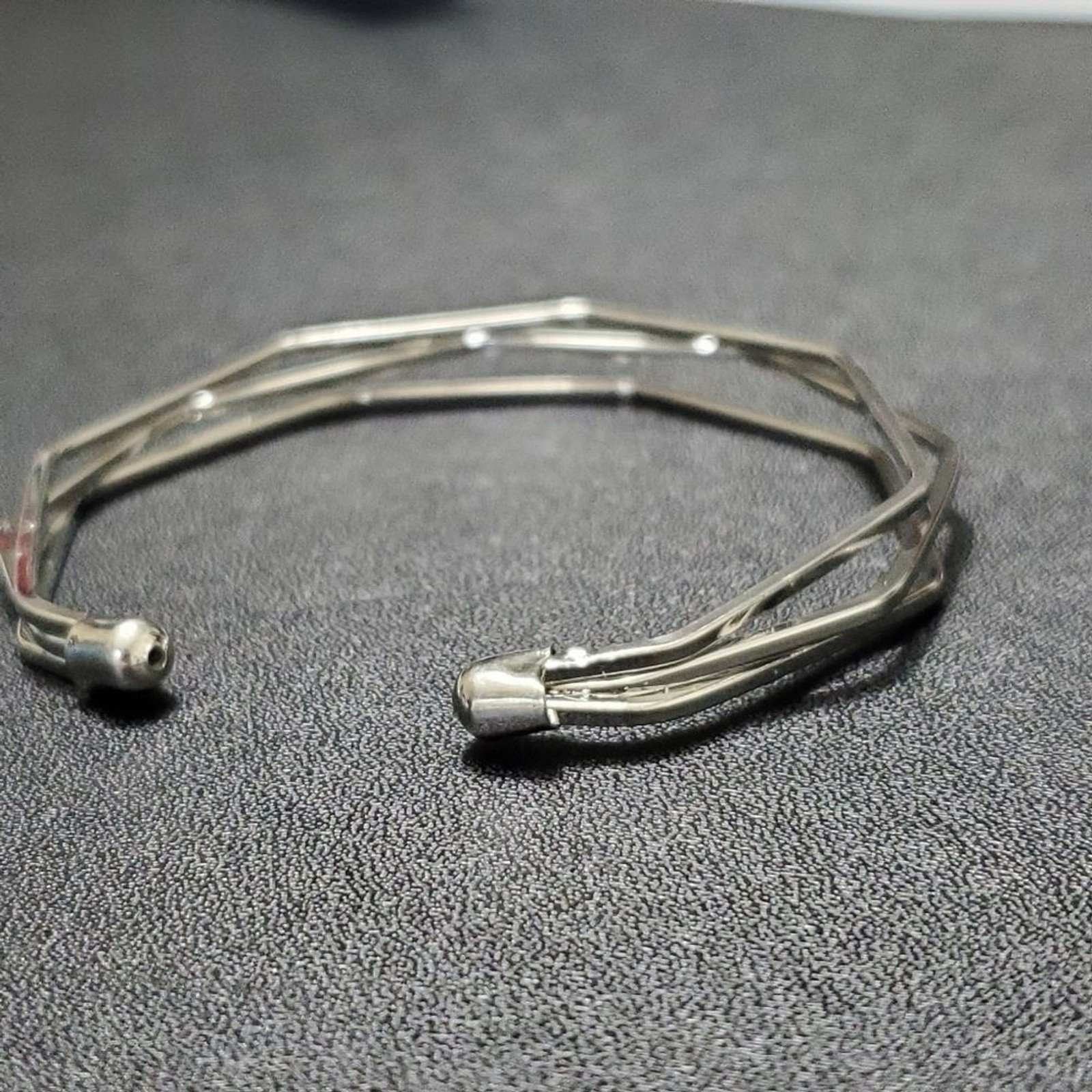 Silver tone angular bangle bracelet - image 4