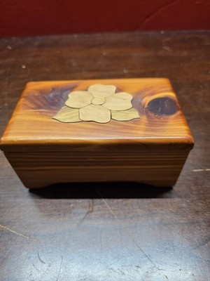 decorative wooden trinket box With an intarsia flower inlay 