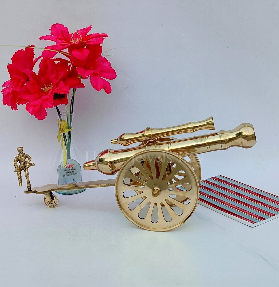 A miniature working-style brass cannon that doubles as a striking desk sculpture — the kind of thing that makes visitors do a double-take.