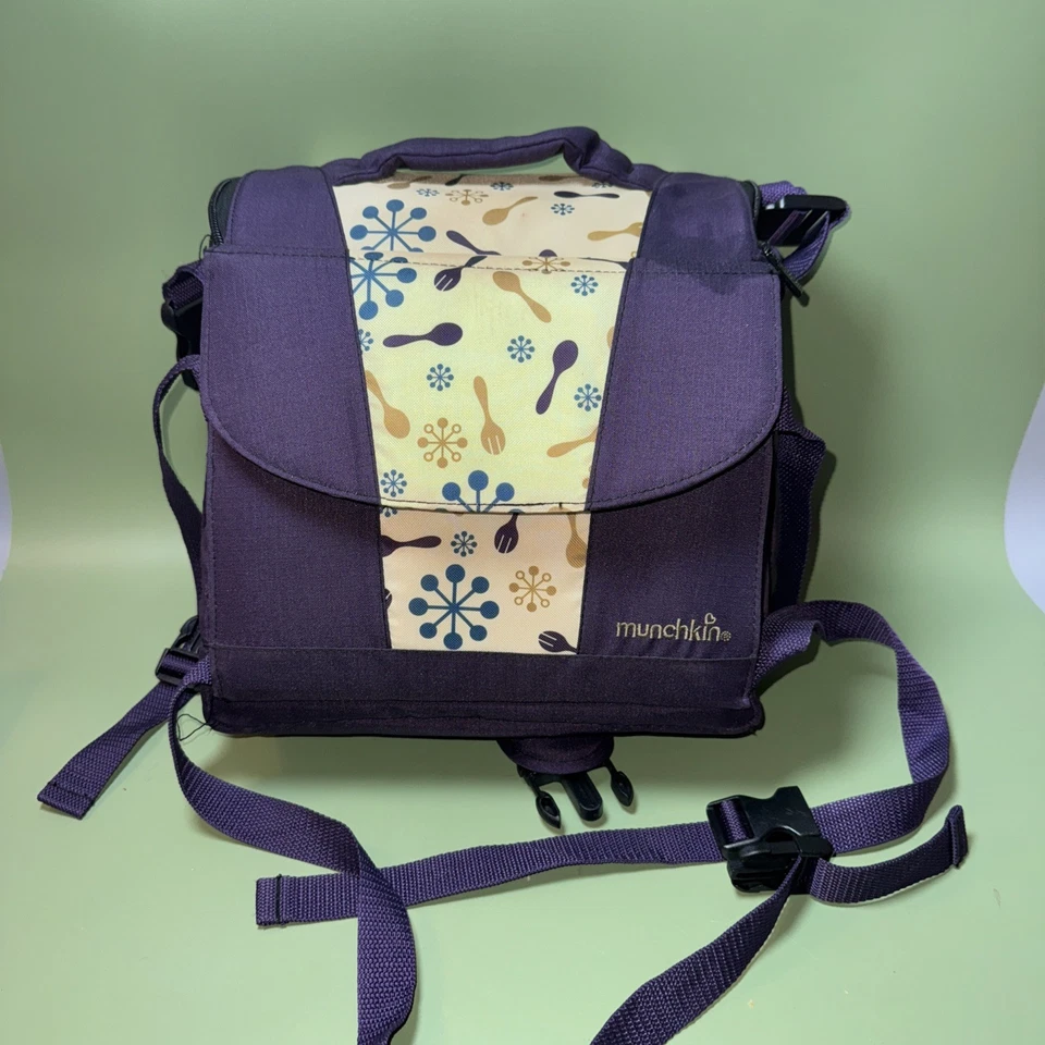 Asiento elevador de viaje Munchkin con almacenamiento interno Foto 2 de 4