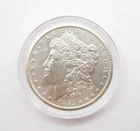 1885 CC United States Morgan 90% Silver Dollar in Plastic Capsule