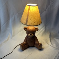 This is a teddy bear table lamp, possibly a vintage or antique item