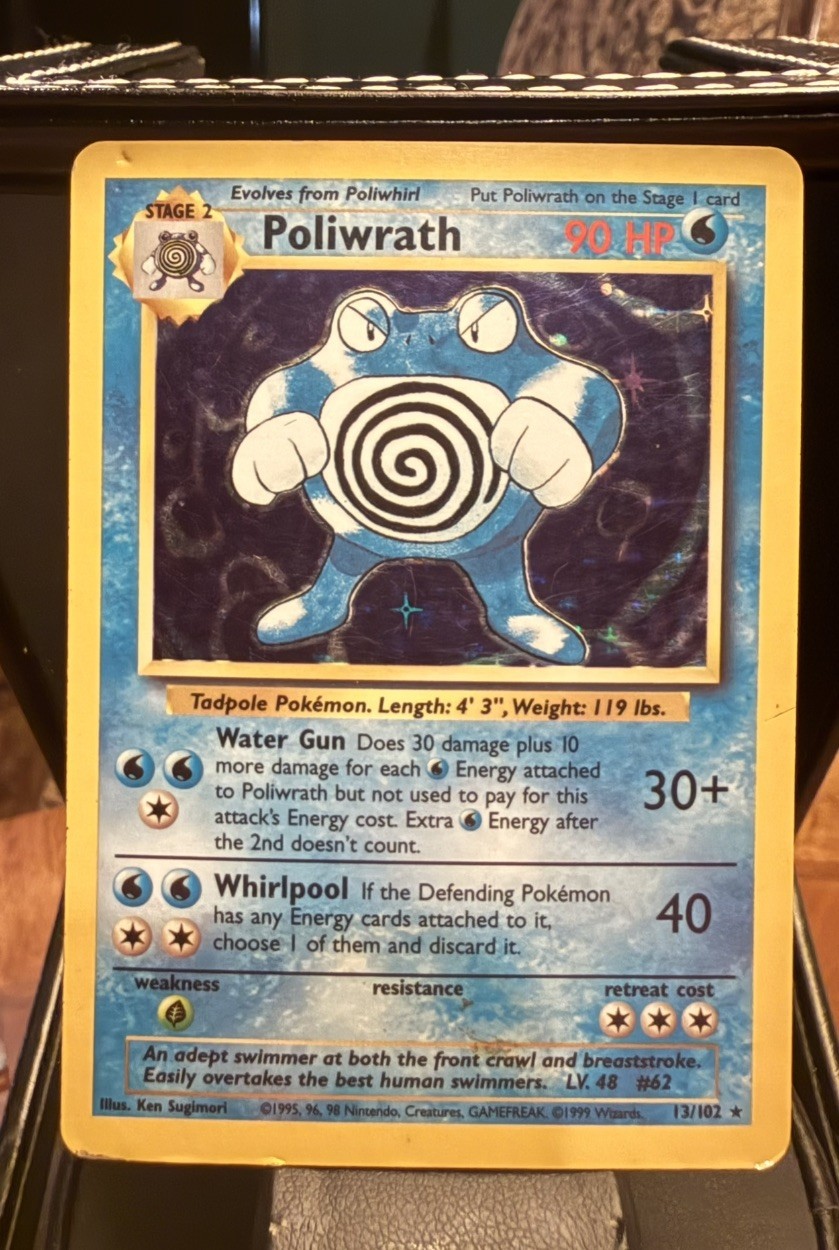 Poliwrath holo rare Pokémon card 13/102 with blue and white swirling Poliwrath, 30 HP, and moves Water Gun and Whirlpool.