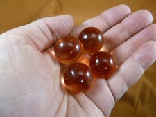 L-61 Four 21mm vintage MARBLES clean amber color with red swirl sphere marble
