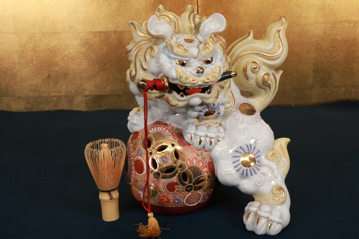 Japanese Porcelain 'Foo Dog with a Sword in its Mouth' Statue