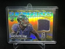 CJ MOSLEY 2014 SPECTRA GOLD PRIZM BUILDING BLOCKS JERSEY RELIC RC #D 17/25