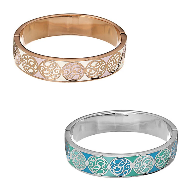 Guess - Bracciale silver con cuore scritta Guess e strass rosso. UBB81006