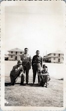 WW2 Photo of four soldiers posing with rifles on grass