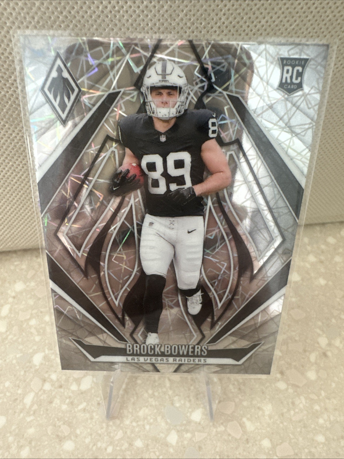 2024 Panini Phoenix - Rookies Brock Bowers #165 Lazer (RC)