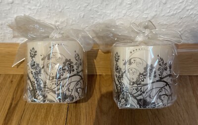 Decorative candle in cylinder beige coated with motif ''NEW''