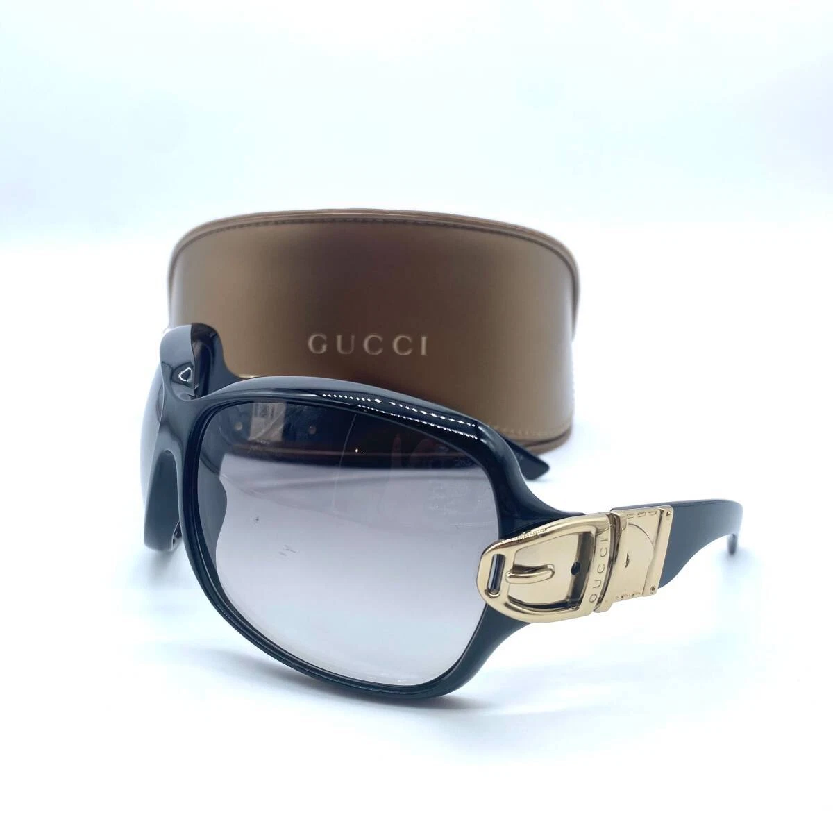 Lunettes de soleil Gucci motif boucle ceinture or noir verres dégradés accessoires unisexes