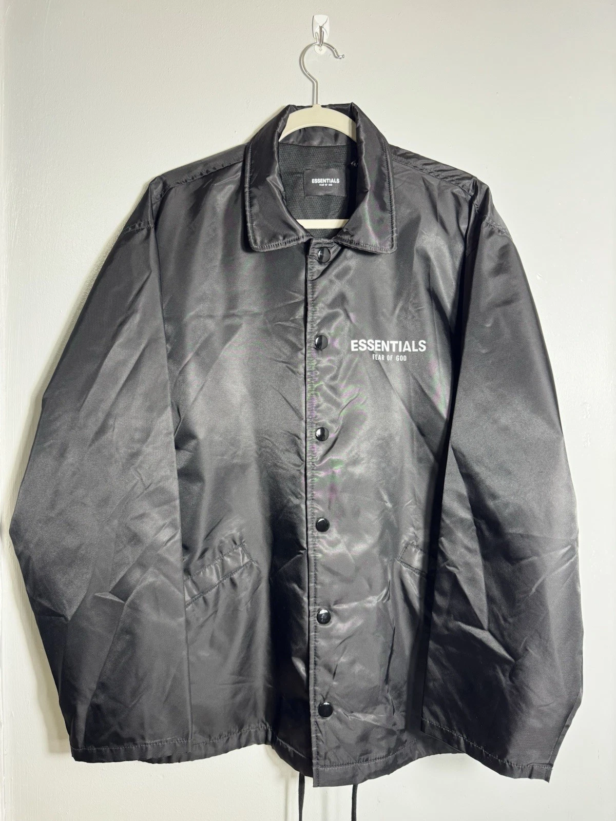 Giacca a vento leggera Fear Of God Essentials nera uomo taglia S oversize