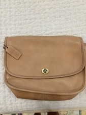 Coach Tan Leather Shoulder Bag with Gold Turn Lock Accent.