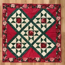 Christmas-themed quilt featuring a "Christmas Stars" And Poinsettias, 40  