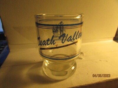 Death Valley- prospector logo on clear-pedestal shotglass-blue/gold-new
