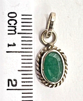 925 St. Silver Pendant Studded with Oval Shape Emerald