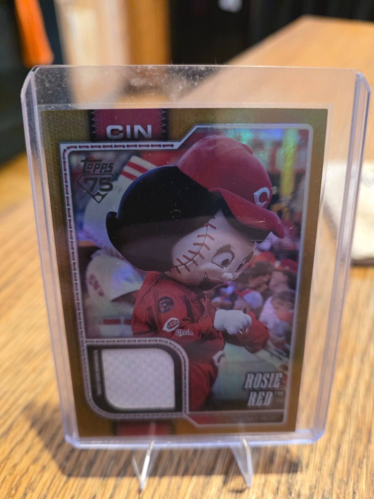 2026 Topps Series 1 Celebration Rosie Red Mascot Relic Gold Foil #'ed 12/50