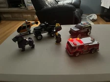 Lot of 6 toys, Firetruck, Police SUV, Helicopter, Tow Truck, Bubble Bee. AS-IS