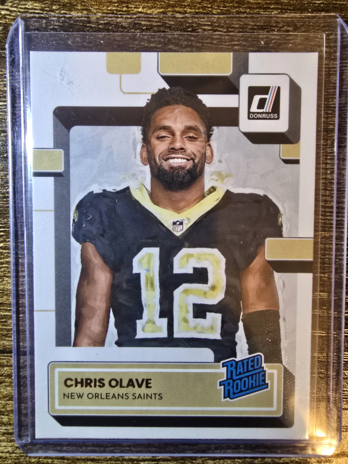 2022 Donruss Football Chris Olave Rated Rookie Canvas #309 New Orleans Saints