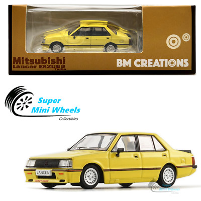 BM Creations 1:64 Mitsubishi Lancer EX2000 Turbo (Yellow) with Accessories