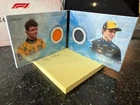 2025 F1 Eccellenza Reliquia La Squadra Lando Norris Oscar Piastri McLaren 44/99