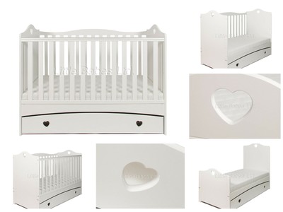 white cot bed with mattress