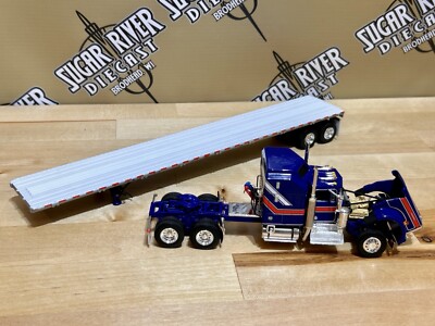 DCP 1/64 Kenworth W900a with flatbed Liberty Edition Trailer